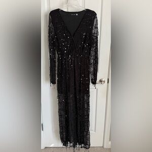 Size Large dress black with dangly sequins.
